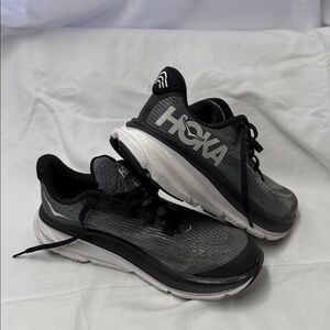 Hoka Black, Gray, and White Athletic Shoes